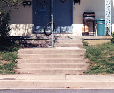 The front porch of the apartment house at 707 Peachblossom Avenue